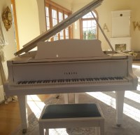 Lot 3652 - A contemporary Yamaha baby grand piano, in...