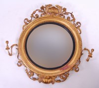Lot 3683 - *A 19th century giltwood and gesso convex wall...