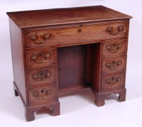 Lot 3715 - *A George III mahogany kneehole writing desk,...