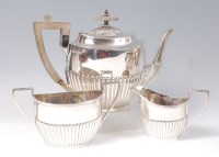 Lot 1168 - A Walker & Hall silver three piece teaset,...