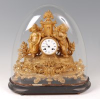 Lot 1557 - A mid 19th century gilt metal mantel clock,...