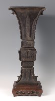 Lot 1410 - A Chinese carved bronze ecclesiastic Gu vase,...