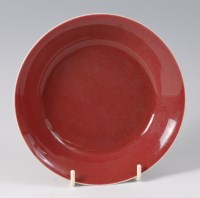 Lot 1415 - A Chinese copper red porcelain saucer-dish, in...