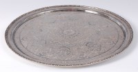 Lot 1421 - A Persian white metal tray, of circular form,...