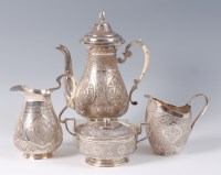 Lot 1426 - A circa 1900 Persian white metal coffee pot...