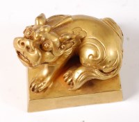 Lot 1433 - A Chinese gilt bronze seal, surmounted with a...