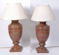 Lot 1571 - A pair of variegated rouge marble lamps, of...
