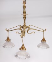 Lot 1599 - An Art Nouveau lacquered brass three light...