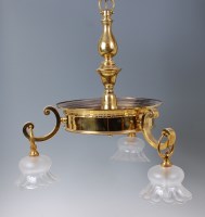 Lot 1600 - An early 20th century lacquered brass three...