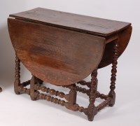 Lot 1621 - A circa 1700 joined oak gateleg table, the...