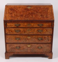 Lot 1625 - A George II figured walnut and walnut writing...