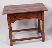 Lot 1636 - An early 19th century joined elm single drawer...