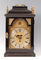 Lot 1517 - A George I ebony and brass mounted bracket...