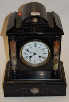 Lot 163 - A late Victorian black slate cased mantel...