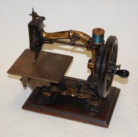 Lot 190 - A Victorian cast iron gilt decorated sewing...