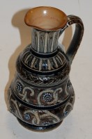 Lot 225 - A Victorian Doulton Lambeth ewer on a mottled...