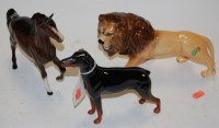 Lot 275 - A Beswick figure of a lion, facing left, model...