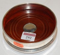 Lot 292 - A modern silver bottle coaster of plain...