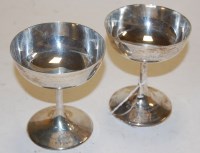 Lot 303 - A near pair of George V silver champagne boats...