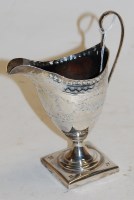 Lot 337 - A George III silver pedestal cream jug of...