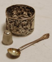 Lot 353 - An Oriental silver napkin ring, chased with...