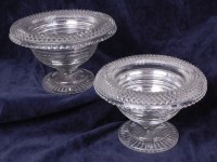 Lot 1104 - A pair of late Georgian Irish glass pedestal...