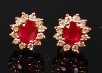 Lot 1147 - A pair of 18ct gold, ruby and diamond ear...