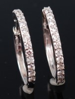 Lot 1151 - A pair of 18ct white gold hoop earrings, each...