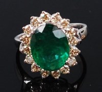 Lot 1160 - A contemporary 14ct white gold, emerald and...