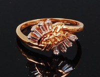 Lot 1161 - A 9ct gold diamond dress ring, arranged as...