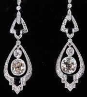 Lot 1163 - A pair of Art Deco 18ct white gold and diamond...