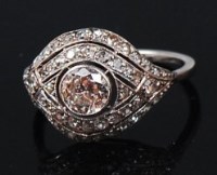 Lot 1172 - A white metal diamond cluster ring, the centre...