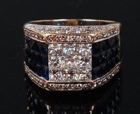 Lot 1174 - A contemporary white metal, sapphire and...