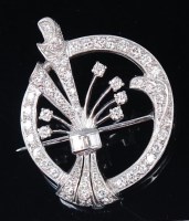 Lot 1185 - A white metal and diamond set openwork brooch,...