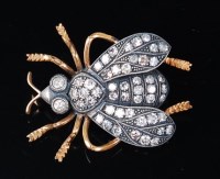 Lot 1186 - A Victorian style yellow metal and diamond set...