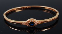 Lot 1196 - A 14ct gold, sapphire and diamond set hinged...