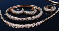 Lot 1198 - An 18ct gold diamond set four piece garniture,...