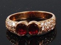 Lot 1199 - An 18ct gold, ruby and diamond ring, by...