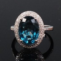 Lot 1200 - A contemporary 14ct white gold, topaz and...