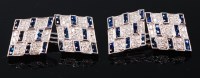 Lot 1212 - A pair of Art Deco style white metal, sapphire...