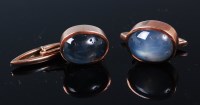 Lot 1214 - A pair of 9ct gold and cabochon 'star'...