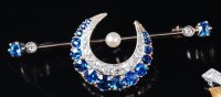 Lot 1238 - A yellow metal, sapphire and diamond set...