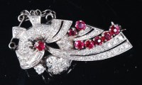 Lot 1239 - An Art Deco white metal, ruby and diamond set...