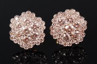 Lot 1244 - A pair of yellow metal diamond cluster ear...
