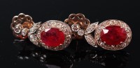 Lot 1245 - A pair of white metal, ruby and diamond set...