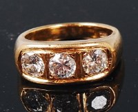 Lot 1249 - A heavy 18ct gold diamond three stone ring,...