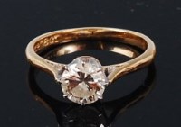 Lot 1259 - An 18ct gold diamond solitaire ring, the claw...