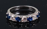 Lot 1260 - An 18ct white gold, sapphire and diamond set...