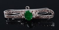Lot 1271 - A white metal (tests as 18ct gold), jade and...