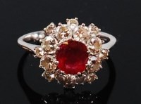 Lot 1276 - An 18ct white gold, ruby and diamond cluster...